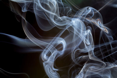 Close-up of smoke against black background