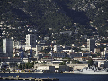 Aerial view of buildings and sea in city