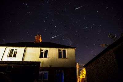 Low angle view of building against sky at night