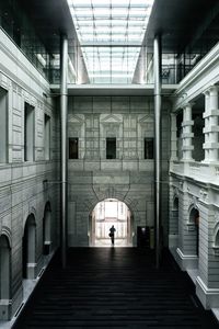 Man in illuminated corridor