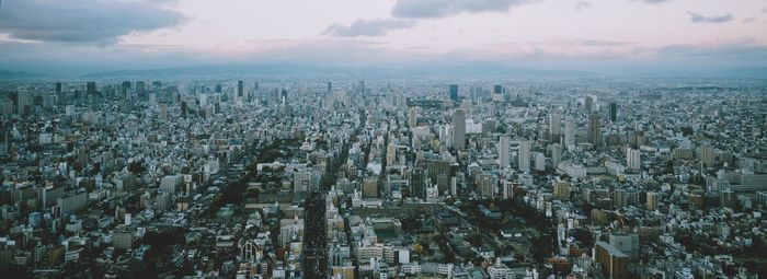 Panoramic shot of agricultural landscape against sky during winter