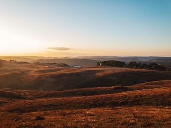 Scenic view of landscape against sky during sunset