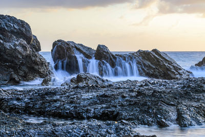 Scenic view of sea against sky during sunset