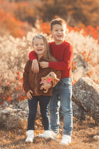 Full length portrait of smiling boy