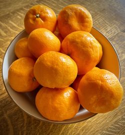 High angle view of mandarins in bowl on table