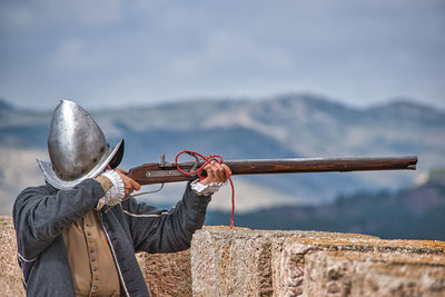 Close-up of metal by sea against sky,third of the 16th century in full battle