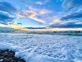 Scenic view of sea against sky during sunset