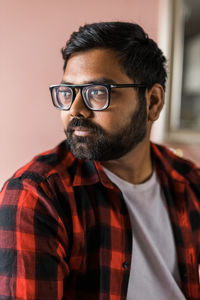 Portrait of young man looking away