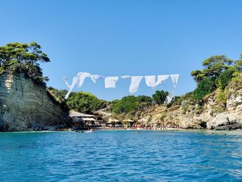 Scenic view of sea against clear blue sky