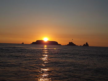 Scenic view of sea against sky during sunset