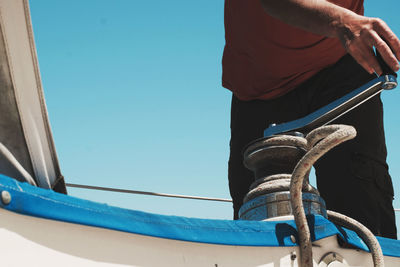 Midsection of man standing in boat