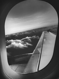 Aerial view of sea seen through airplane window