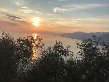 Scenic view of silhouette mountains against sky during sunset