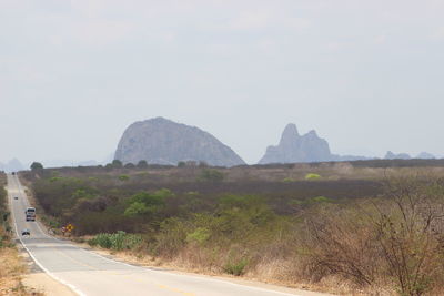 Road leading towards mountains