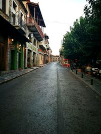 Narrow street along buildings