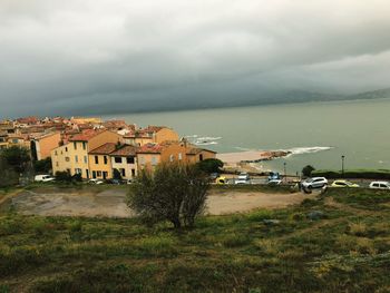 High angle view of houses and buildings against sky