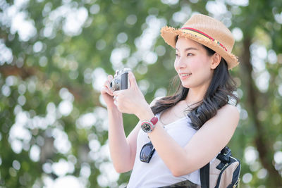 Young woman using mobile phone outdoors