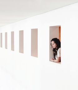 Woman leaning through window