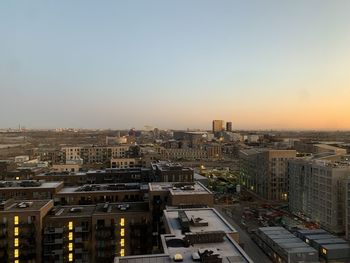 High angle view of buildings in city against clear sky