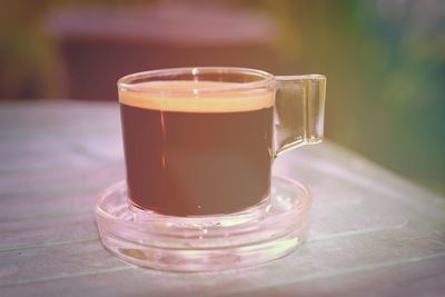 Close-up of coffee cup on table