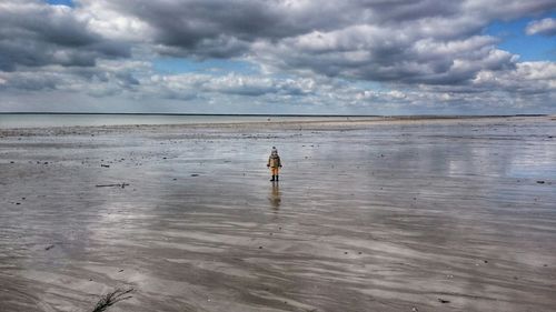 Scenic view of sea against cloudy sky