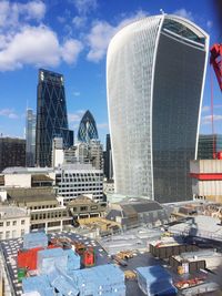 Modern buildings in city against sky