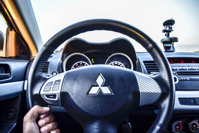 Close-up of hand on car