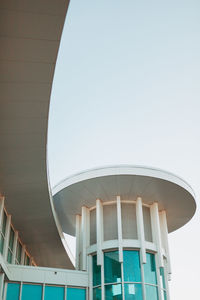 Low angle view of modern building against clear blue sky