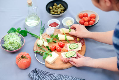 Woman arranging food on table