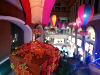 Close-up of illuminated cake on table in restaurant