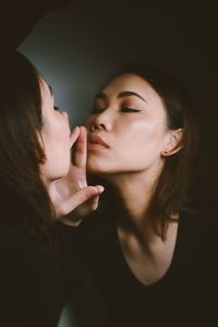 Woman touching mirror