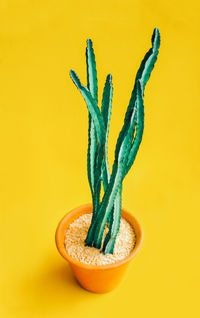 Close-up of banana against yellow background