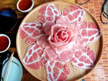 High angle view of pink roses on table