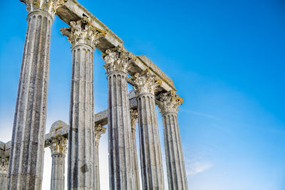 Low angle view of temple against blue sky