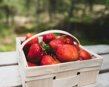 Close-up of strawberries in basket on table