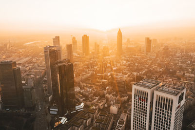 High angle view of city buildings during sunset