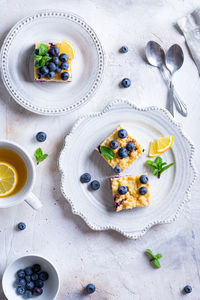 Blueberry pie with cottage cheese on white plate