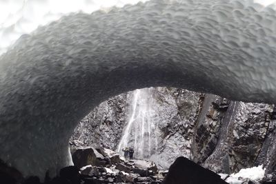 View of sea through tunnel