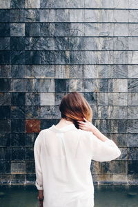 Person standing by wall