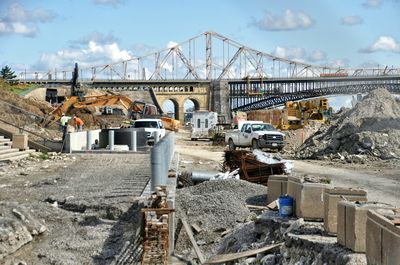 Construction of bridge against sky