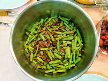 High angle view of chopped vegetables in bowl on table