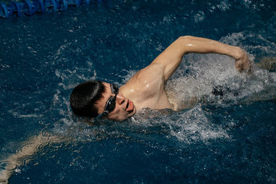 High angle view of man swimming in pool