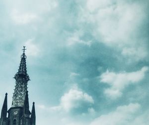 Low angle view of statue against sky in city