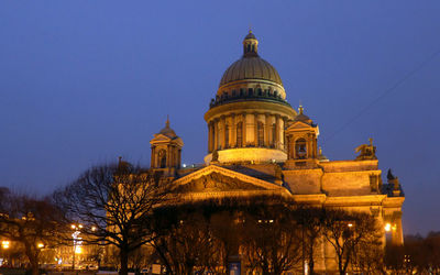 Low angle view of illuminated st isaac cathedral against clear sky at dusk