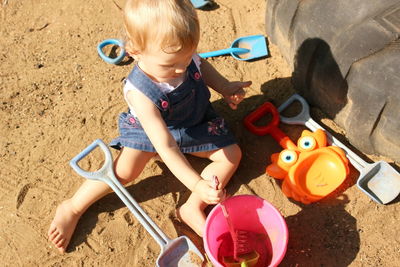 Little girl playing with toy