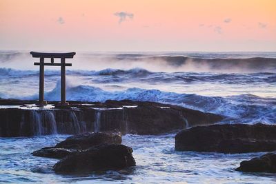 Scenic view of sea against sky at sunset