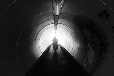 People walking in tunnel