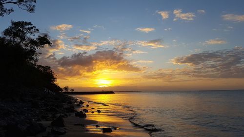 Scenic view of sea against sky at sunset