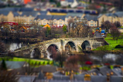 Arch bridge over water in city