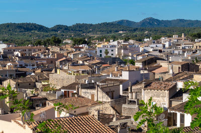 High angle view of townscape and mountains